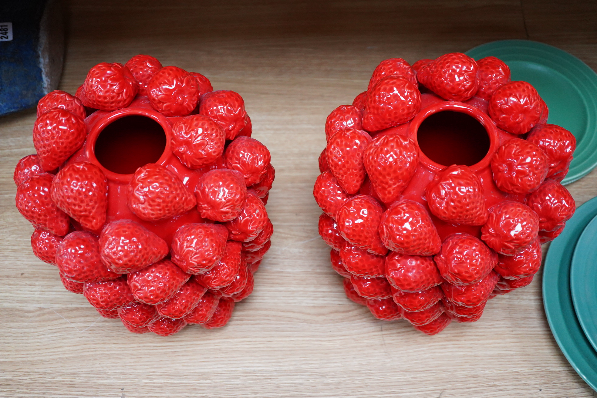 A pair of multi strawberry ceramic vases, 32cm high
